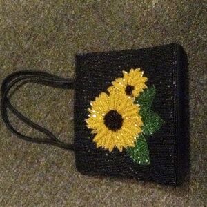 Small black Sunflower embezzled beaded purse. In great condition!